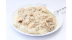 A plate of Amish Chicken (from the Instant Pot Amish Chicken Recipe from 365 Days of Slow Cooking): Features a plate of white stew over mashed potatoes.